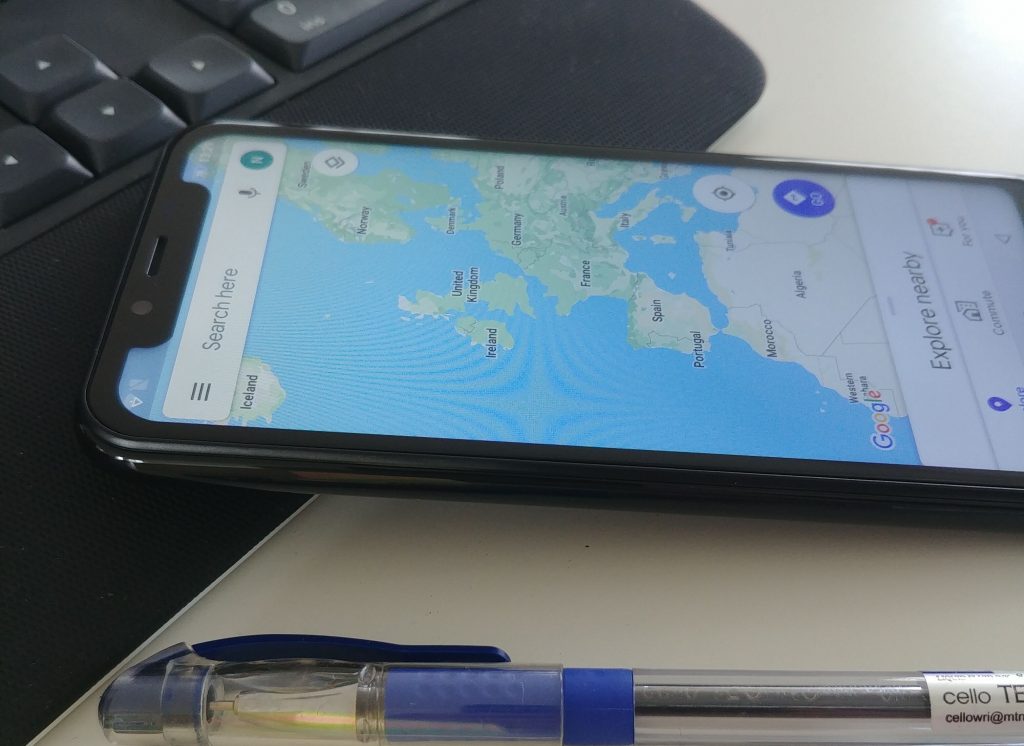 Smartphone lying on a desk with map open